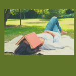 woman relaxing outdoors on blanket with a book over her face