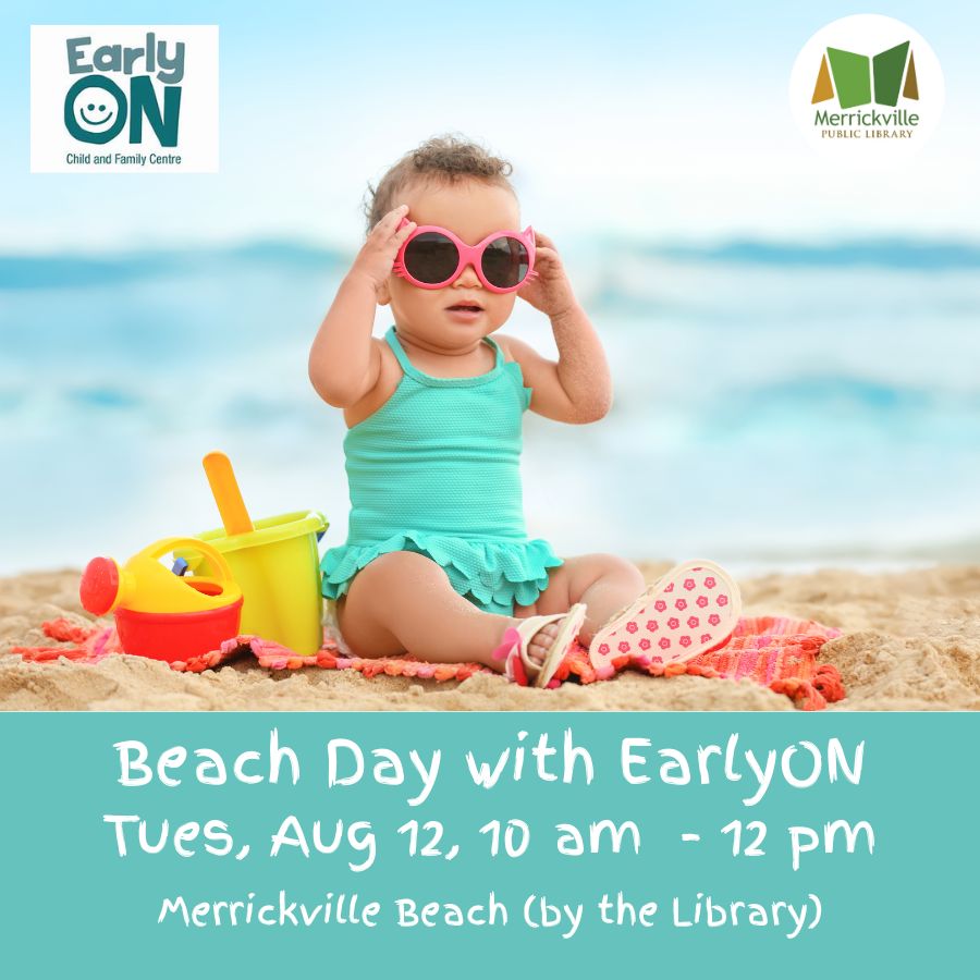 Toddler on the beach with toys